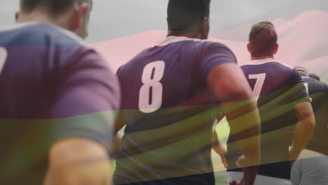 animación de la bandera de alemania sobre diversos jugadores de rugby en el campo