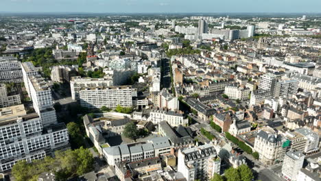 aerial flying forward over city of rennes on sunny day, france