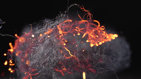 glowing fire among rolled wire threads of steel wool