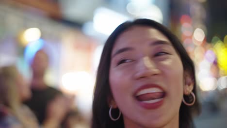 woman smiling in night city