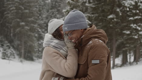 couple enjoying a snowy winter day