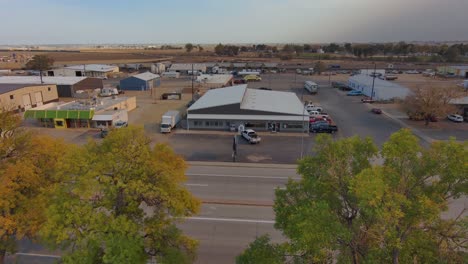 An-industrial-park-in-a-rural-community-establishing-shot-with-drop-into-trees