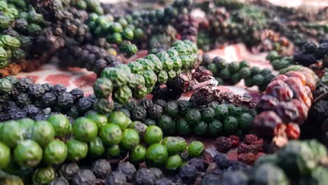 Close-up-zoom-in-shot-of-colorful-peppercorns-drying-in-open-air