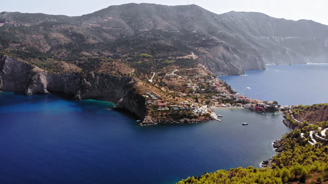 Asos Village As Seen From The Assos Castle Peninsula On The Island Of Cephalonia, Greece - aerial drone shot