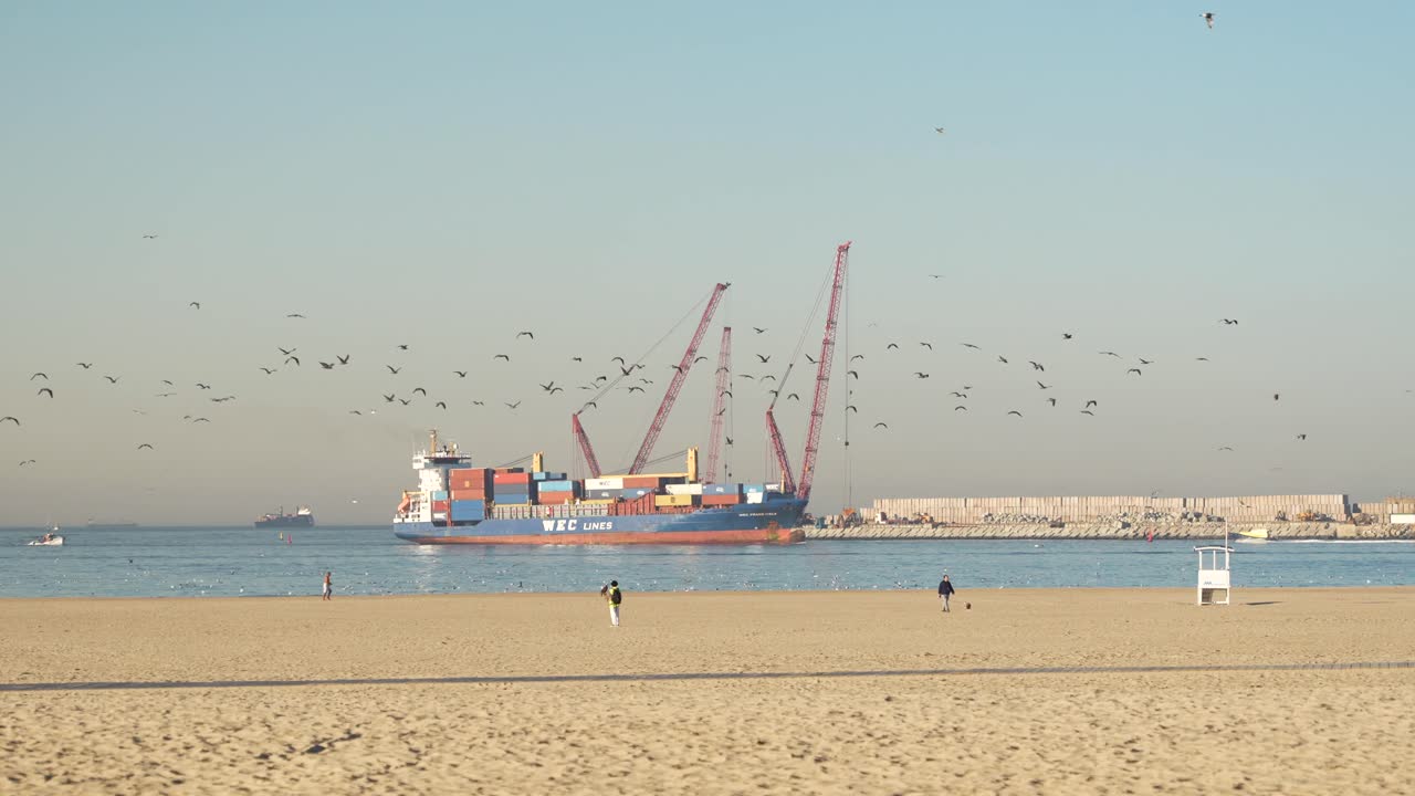 Commercial container ship approaching port of Leixoes in Portugal