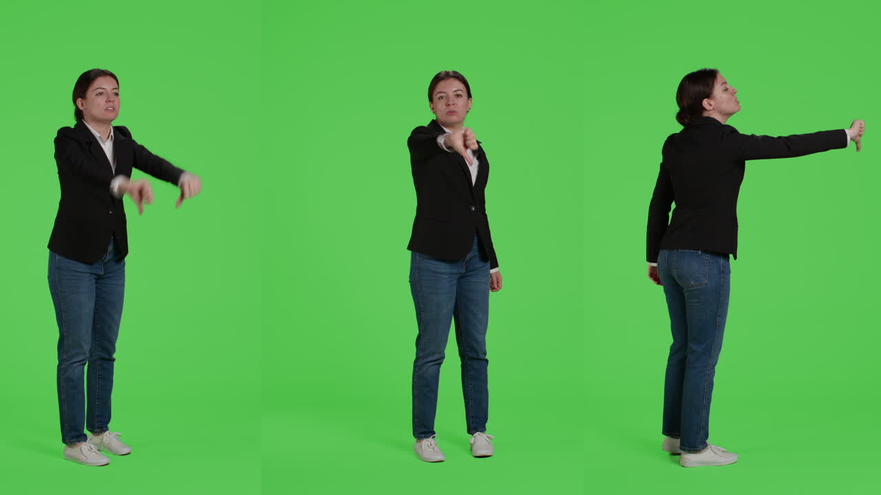Businesswoman giving thumbs down gesture on green screen