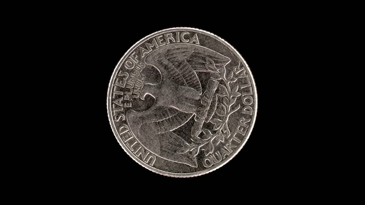 United States 1991 quarter dollar coin reverse with eagle and olive branches rotating on black background