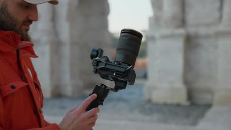 videographer with innovative dji rs3 stabilized gimbal with professional camera mounted outdoors