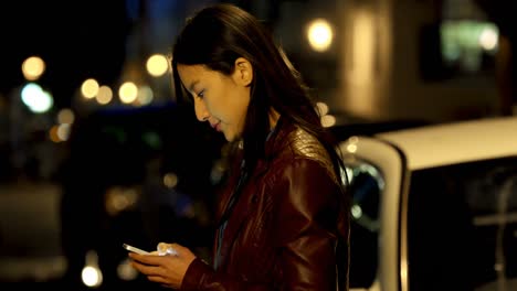 Woman-using-mobile-phone-in-street-4k