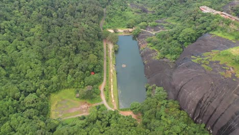 Aerial-view-of-Lake-in-Karinja-Temple,-DK-KA-India