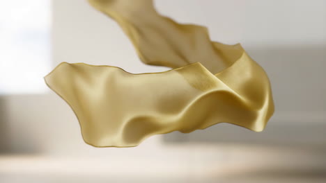 Golden Flowing Fabric on a Light Background