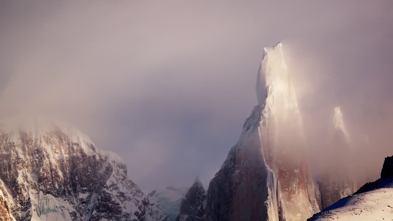 Time-lapse of Cerro Torre covered with ice and snow in los glaciares national park. Scenic nature background