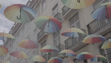 colourful umbrellas in the lisboa portugal log