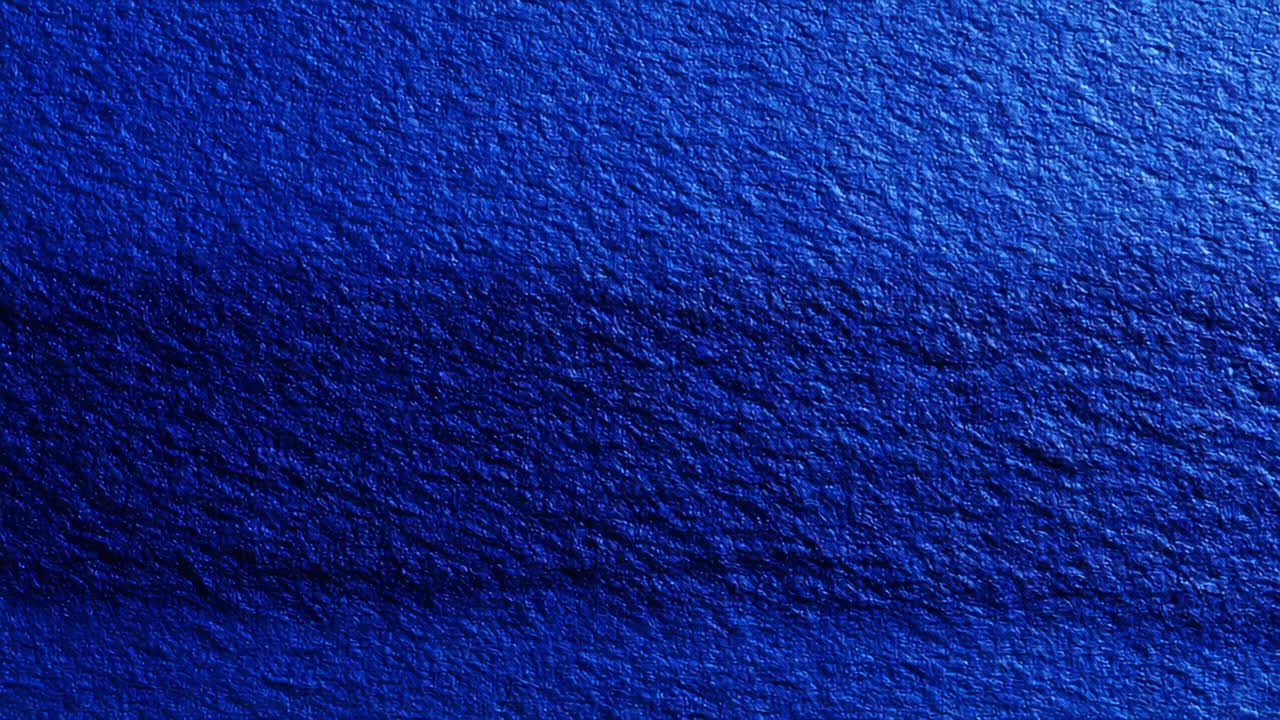 Un'analisi approfondita di superfici blu texturizzate che catturano le complessità di luci e ombre, mettendo in mostra il fascino del colore e le variazioni della superficie con dettagli straordinari