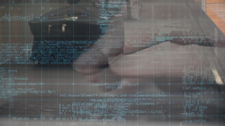 Data processing against conveyor belt with luggage and person typing on keyboard