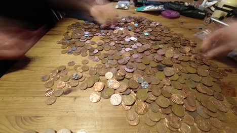 couple budgeting counting coins time lapse financial savings planning expenses