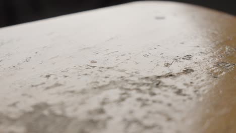 close-up of a worn wooden surface with detailed textures and patterns