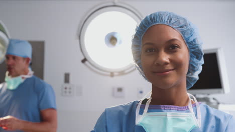 portrait of female surgeon wearing scrubs in hospital operating theater