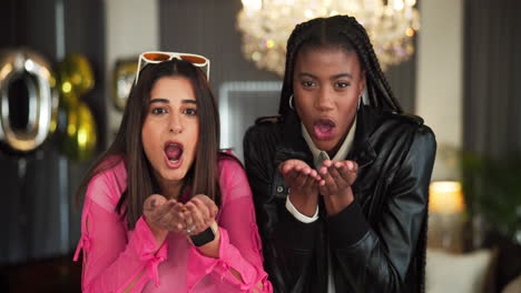 two women celebrating with confetti