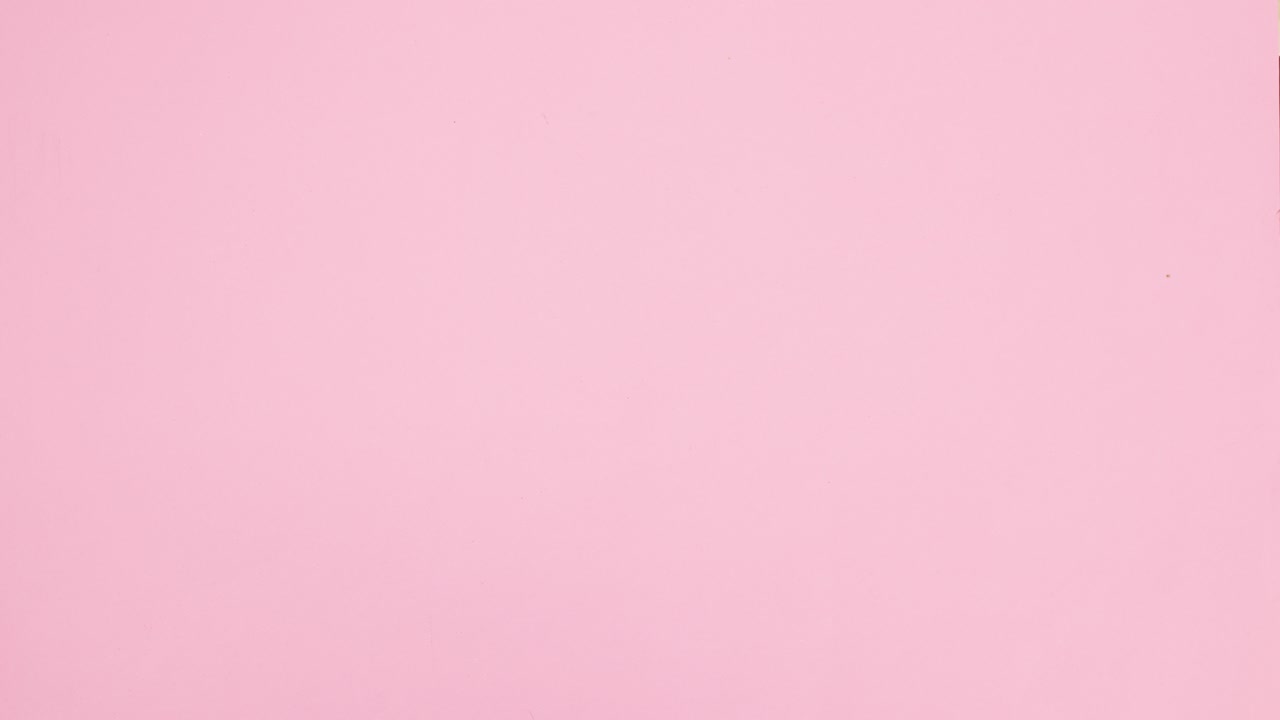 Gold Christmas decoration with balls, stars and ribbons appear on right side of pastel pink theme. Stop motion