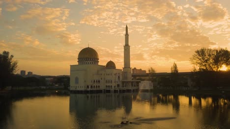 drone view of  mosque with yellow rooftop