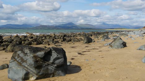 Wide-Shot-of-Rocky-coastline-No-8,-looking-towards-the-Llyn-Peninsula-from-near-Morfa-Dyffryn,-Wales,-UK,-Static-Camera,-10-Second-version