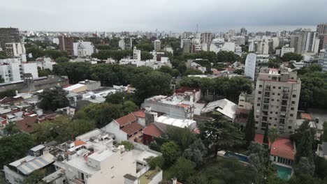 Aerial-Drone-Fly-Around-Villa-Ortuzar-Chacarita-Neighborhood,-Buenos-Aires-City-Argentina-Green-Urban-Landscape-during-Summer