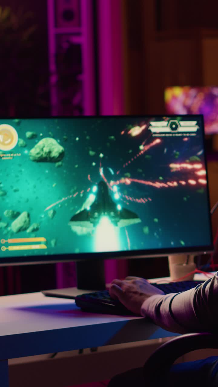 Vertical video Upset gamer hitting desk in frustration after receiving game over screen, getting destroyed