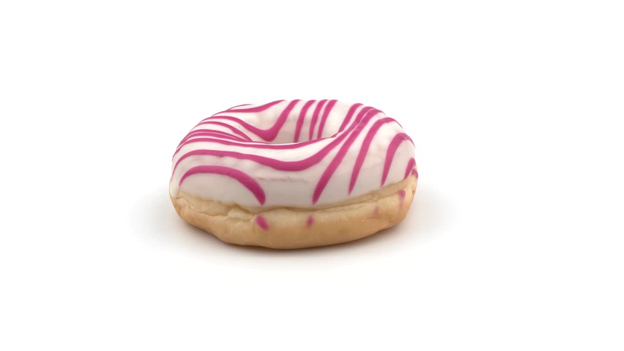 Donut on a white background. Sweet pastries with pink frosting.
