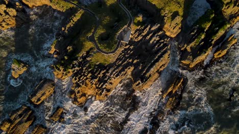 calm and warm golden hour light over spectacular shape rocky cliffs