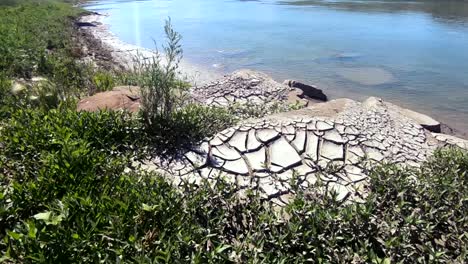 Mountain-of-cracked-nature-clay-on-the-shore-of-a-river-at-Sandy-Point-Alberta-Canada