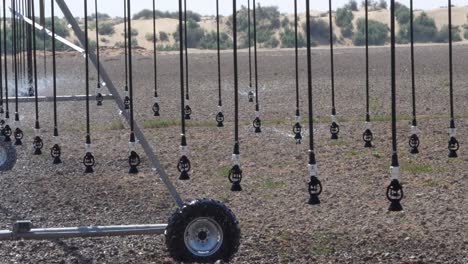 view of sprinklers on center pivot irrigation system watering field