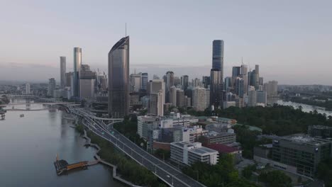 cinematic drone flying past brisbane city looking towards southbank