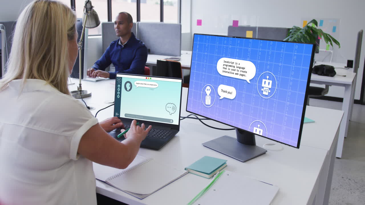 Caucasian businesswoman using laptop and computer with digital chat and icons in office