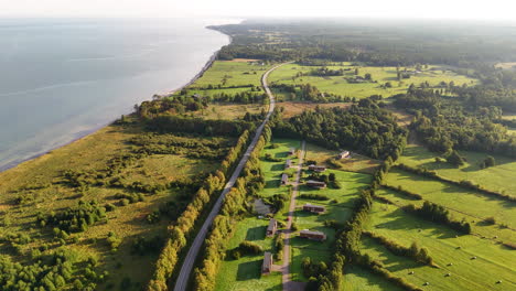 travel along the baltic sea coastline in south kurzeme, latvia. aerial view revealing the scenic coastal highway from strante to ulmale.