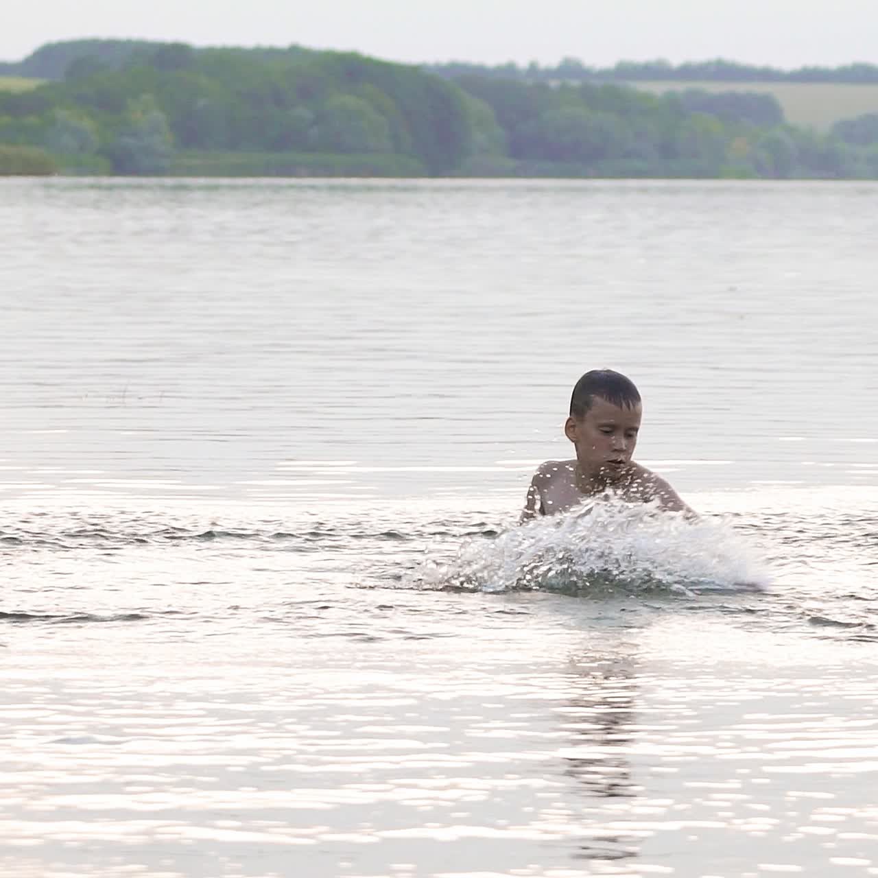 Jumping in the water. Boy are having fun and splashing in the water. Summer holiday concept