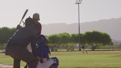 baseball player hitting a ball during a match