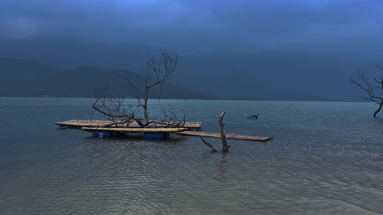 Serene View Of A Wooden Raft Over Lake. Static Shot