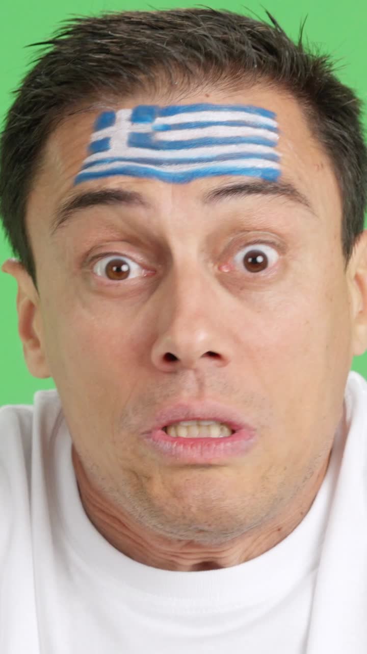 Man with greek national flag upset with a referee