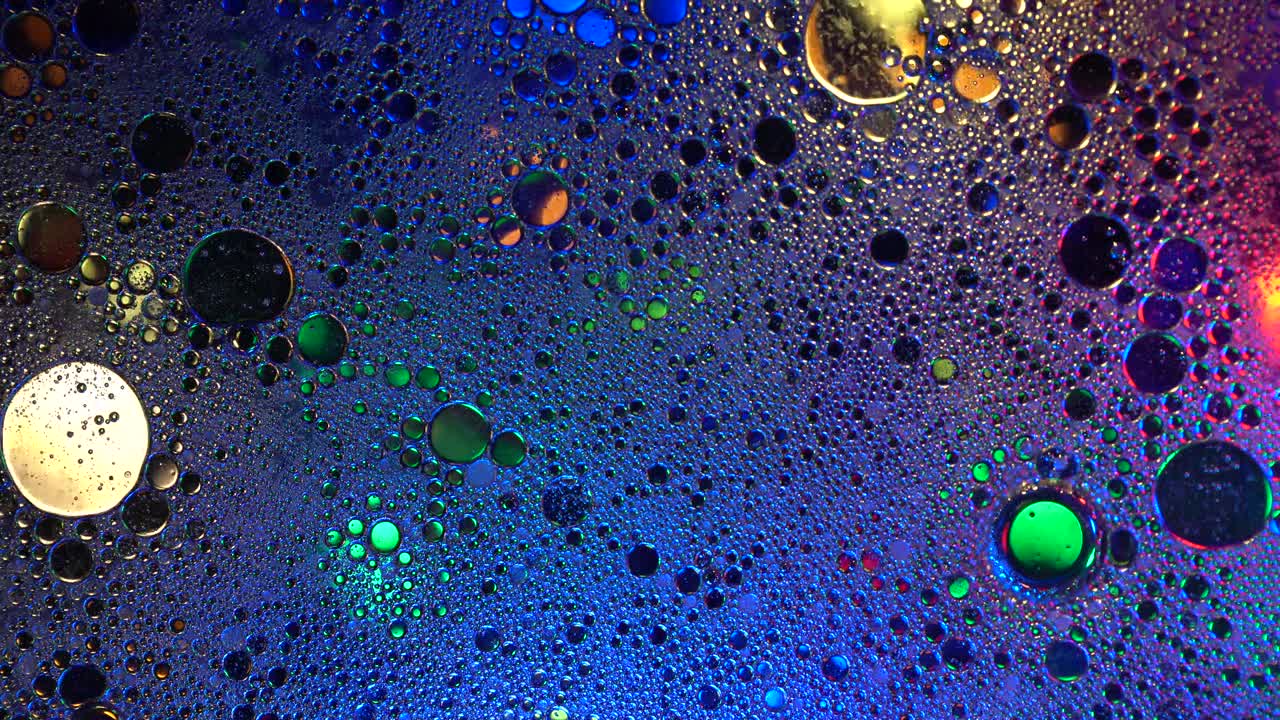Colorful background and texture oil with water surface foam of soap with bubbles