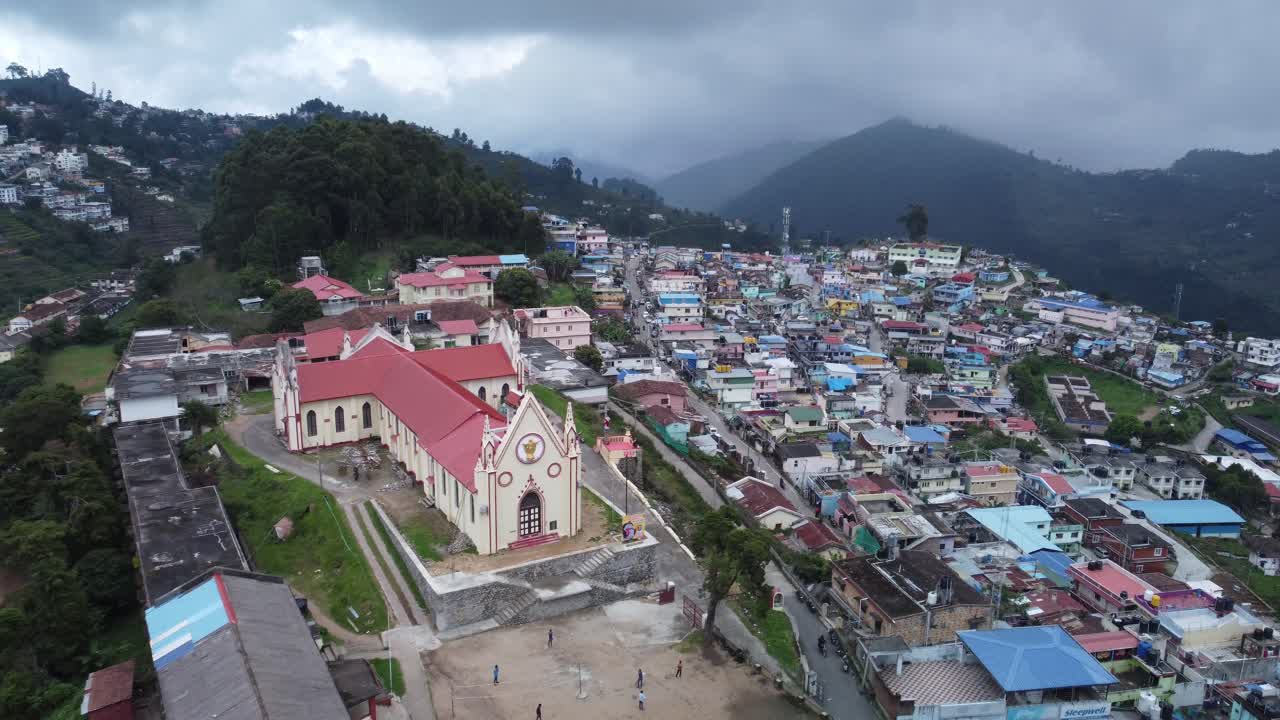 Establishing drone shot of Kodaikanal town, Sacred Heart Catholic Church, Dindigul, Tamil Nadu, India