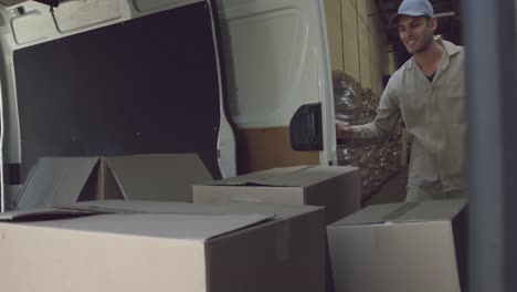 young male van driver with a warehouse delivery