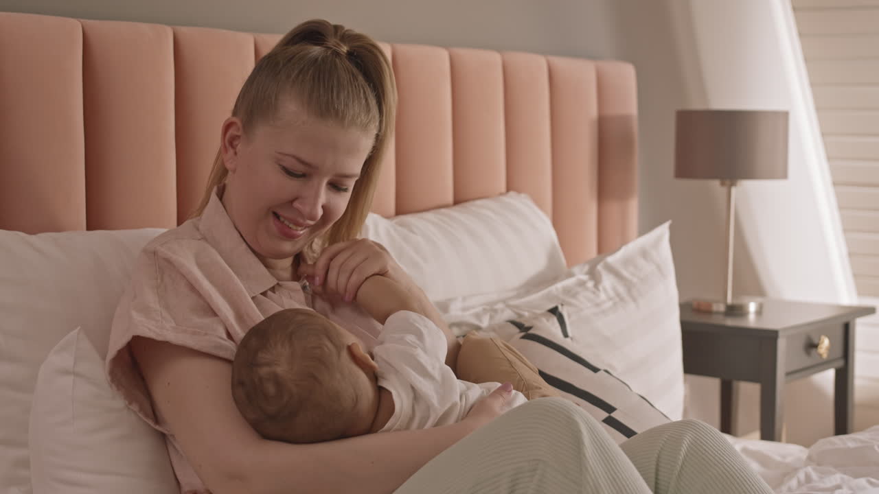 Young Woman Breastfeeding Child