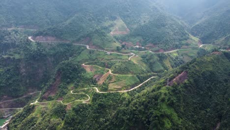 On-beautiful-Vietnamese-landscape-background-vehicles-travel-a-winding-road