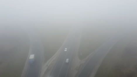 strong fog on the road aerial drone view