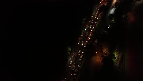 aerial shot over traffic at night