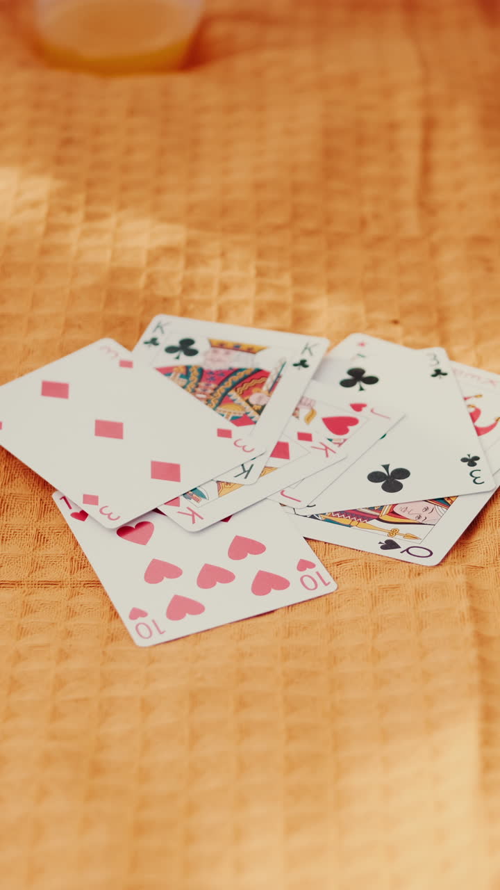 Cards on the blanket, Friends Playing Cards at a Summer Picnic