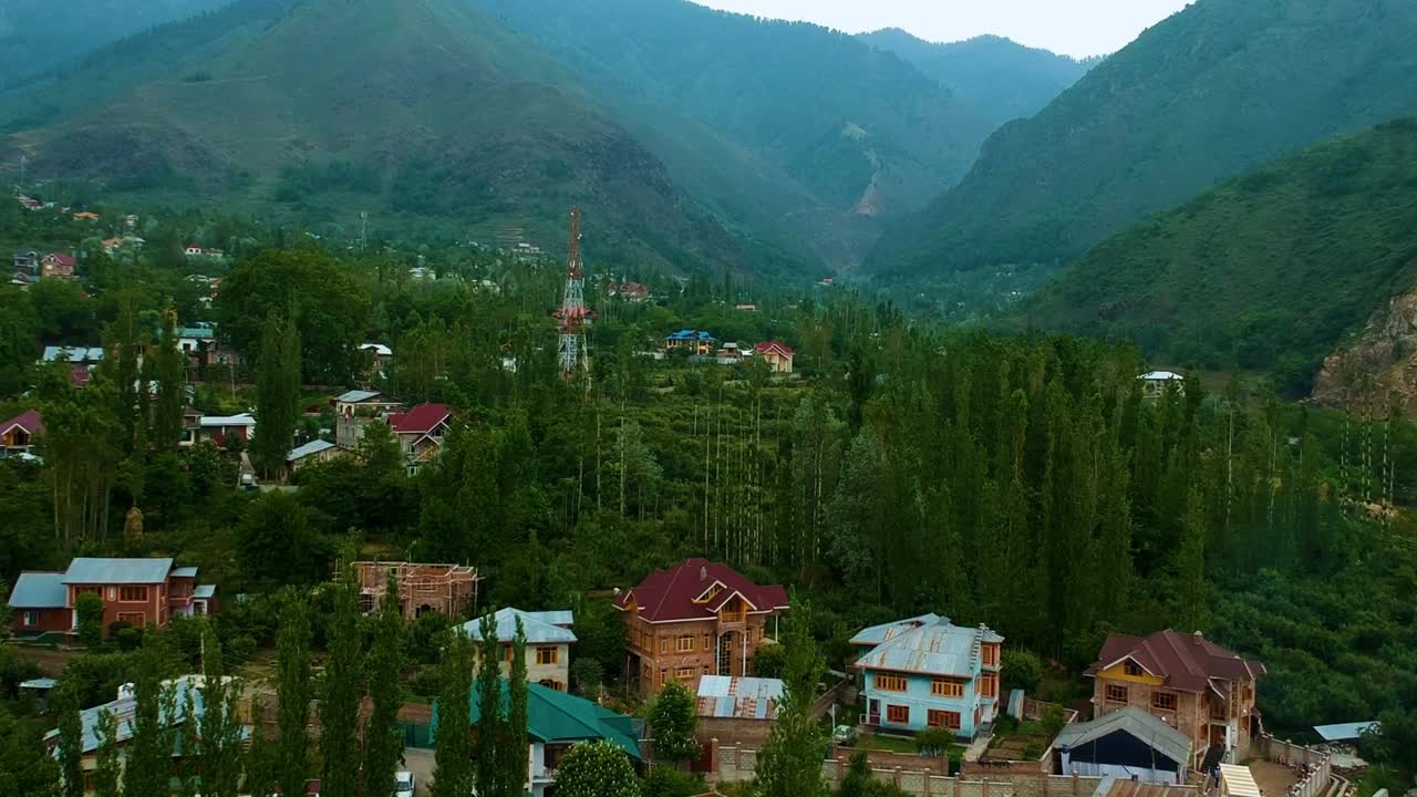 Typical Houses With Lush Foliage On Mountainous Landscape In Srinagar, Jammu and Kashmir, India. drone ascend