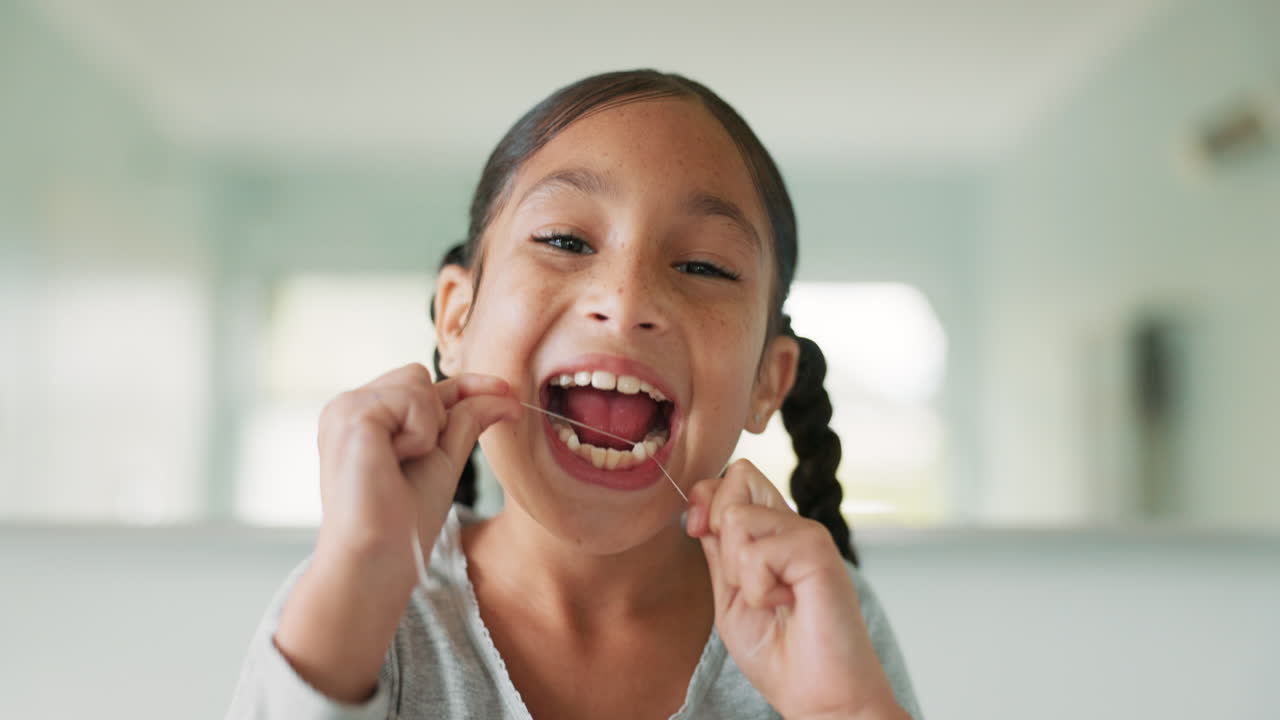 Girl child, floss and cleaning for dental hygiene