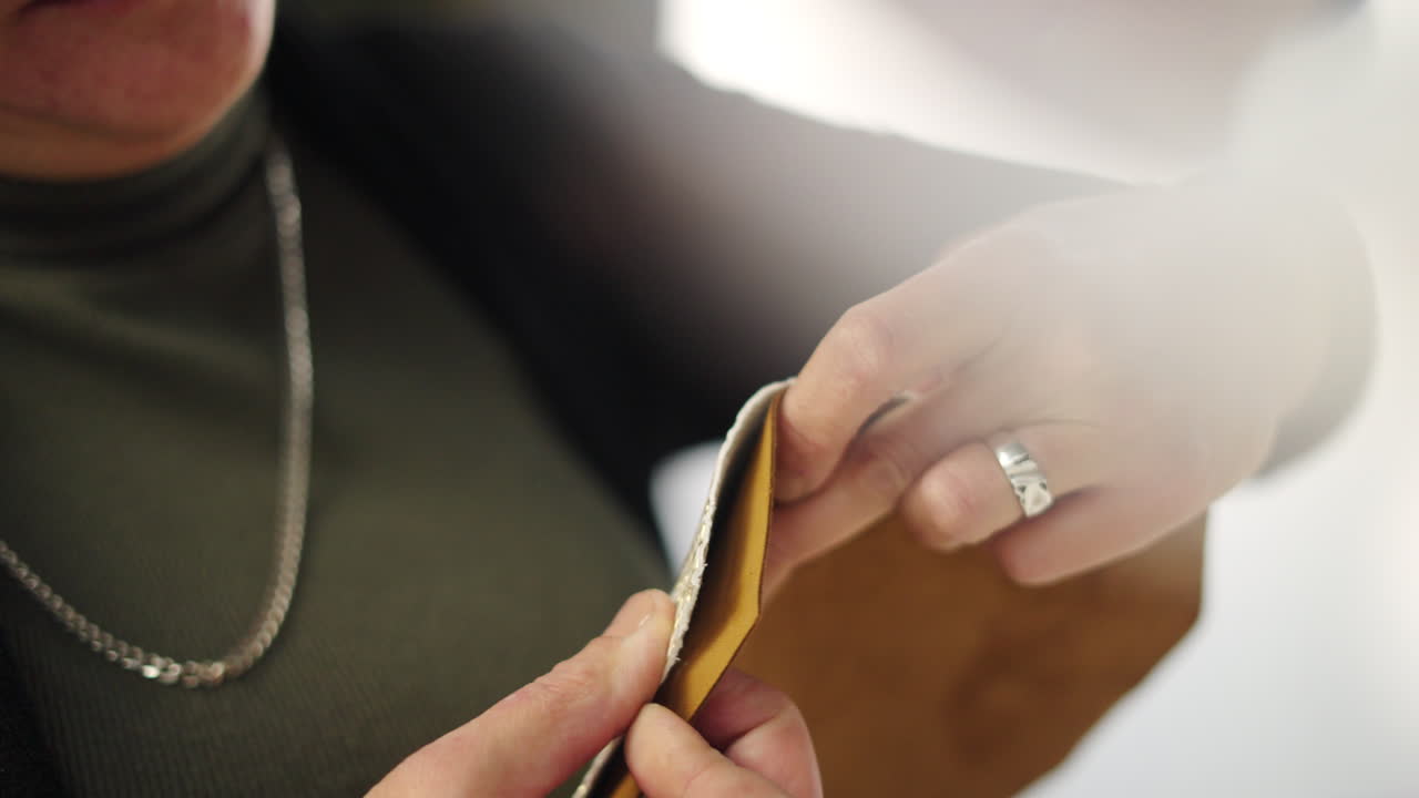 Close-up of hands working with craft materials